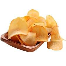 Professional overhead shot of Paithrka Tapioca Chips, featuring a black bowl filled with crispy, ridged golden-brown cassava chips and a branded product pouch on a white marble background